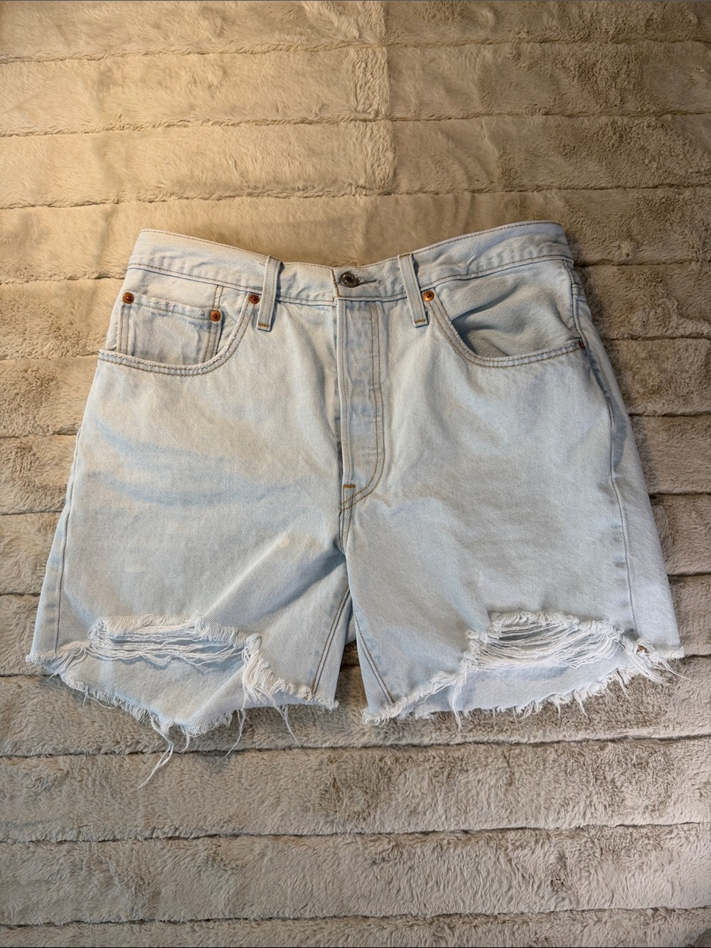Classic Levi’s 501 Light Blue Distressed Denim Shorts, 32 waist 5 in. inseam.